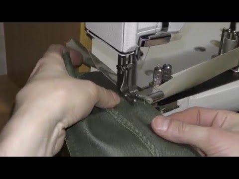 Промышленная швейная машина для окантовки края изделия.