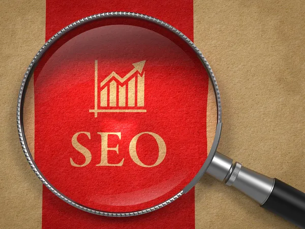 SEO через увеличительное стекло. Концепция Интернет Лицензионные Стоковые Фото